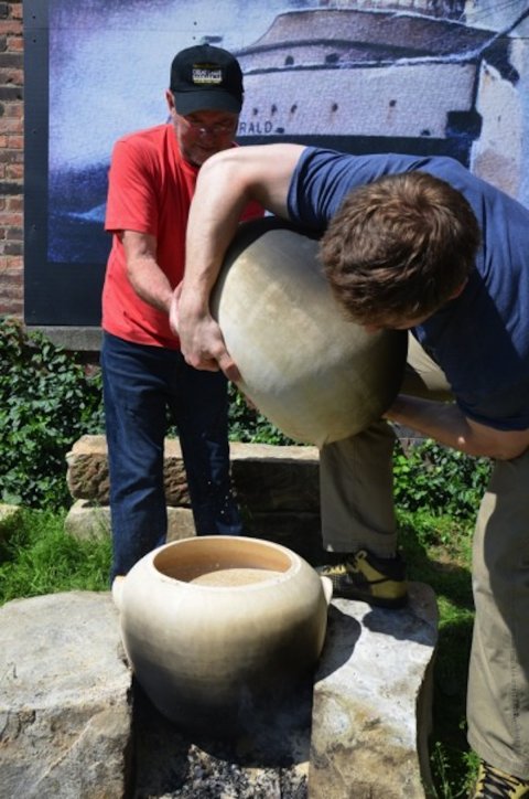 Brewers at Great Lakes Brewing using Sumerian style clay pots.