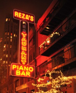 Exterior and glowing sign of Reza's