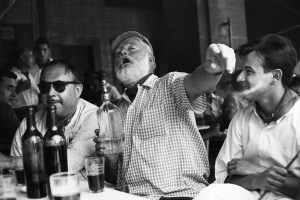 Ernest Hemingway drinking Gin.