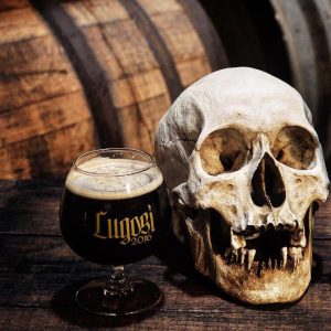 A skull on a barrel next to Phantom Carriage Brewery's Lugosi beer