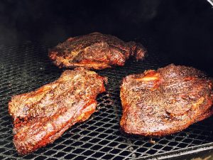 Brisket on the smoker at The Gas Station in Bastrop
