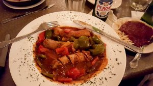 A plate of italian sausage in sauce at Saputo's Italian Restaurant.
