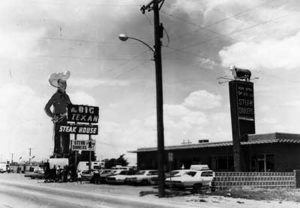 A historical look back at Amarillo's The Big Texan Restaurant with old cars and the big sign.