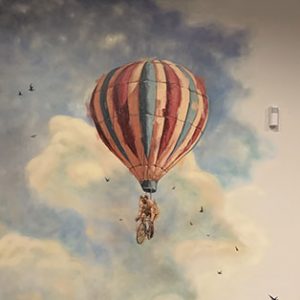 FIcklewood's mural showing a floating hot air balloon.